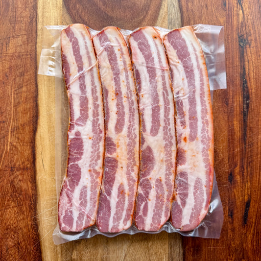 Strips of MTRY bacon steaks on a cutting board