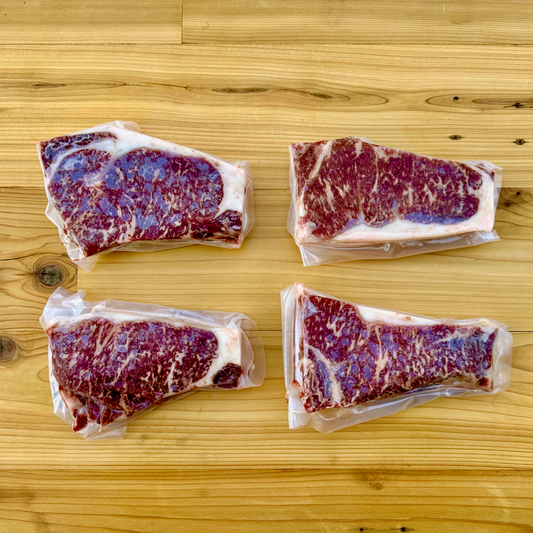 The American Wagyu New York Strip Steaks box from Verlinde Farms, consisting of your choice of 2 or 4 American Wagyu New York Strip Steaks.