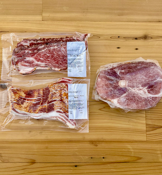 Contents of the Breakfast Lovers Box from Backstreet Market. Contains 1 pack bacon, 1 pack country bacon, and 1 ham steak.