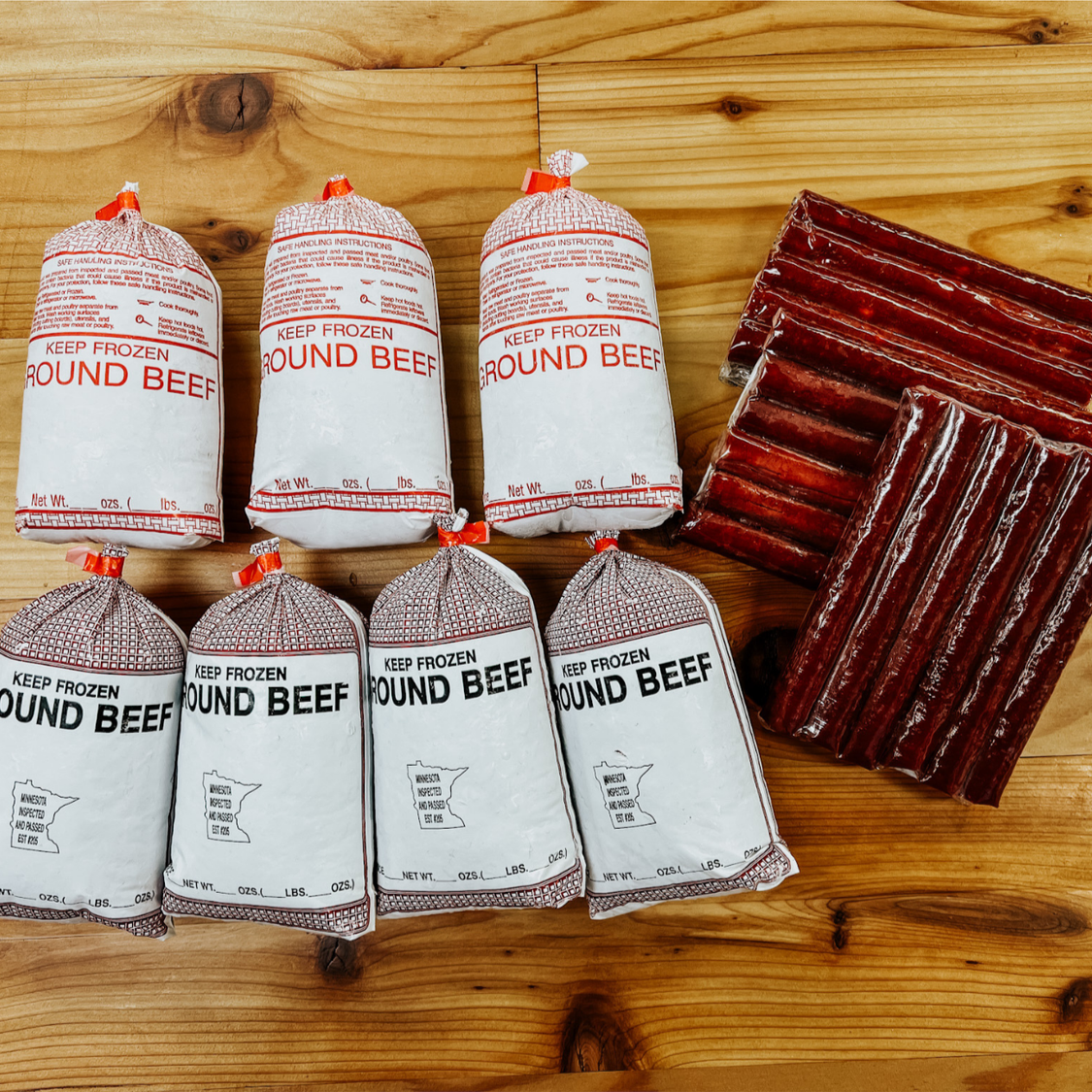 The Dry-Aged Burger and Beef Stick Box from Backstreet Market featuring 7 pounds of dry-aged ground beef and 3 packs of dry-aged all-beef snack sticks.