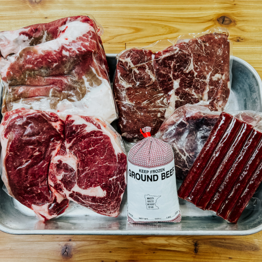 Beef up box including 2 Ribeye Bone-In Steak, 1 Beef Tenderloin (Filet Mignon), 1 Beef Brisket or Tri Tip, 2 Sirloin Steaks, 1 Ground Beef, 1 Flavor of the Month Beef Sticks