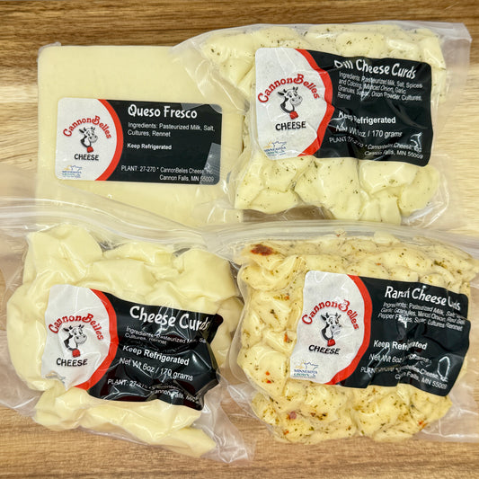 Contents of the CannonBelles Cheese Curds and Queso box, including queso fresco cheese, dill cheese curds, white cheddar cheese curds, and ranch cheese curds. 