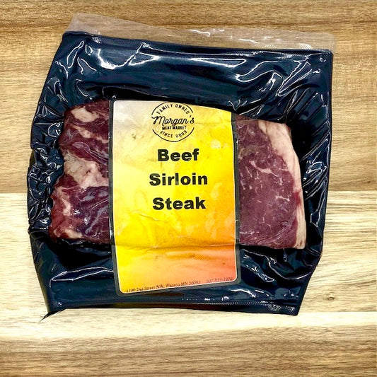 Packaged beef sirloin steak from Morgan's Meat Market on a wooden background