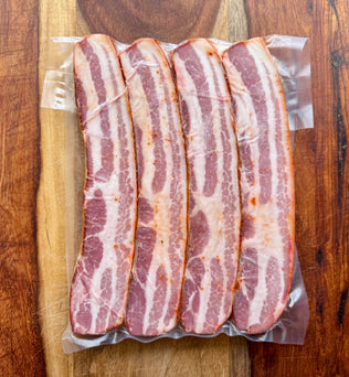 Strips of MTRY bacon steaks on a cutting board